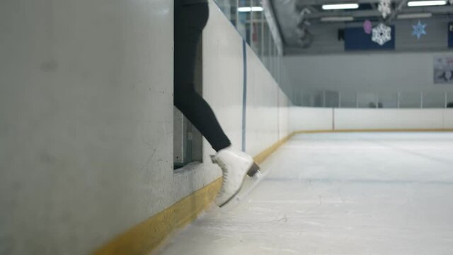 Young woman finishes training and leaves the ice