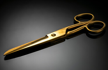 
Old scissors gold color on gray gradient background