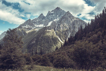 Fototapeta premium Beautiful mountain landscape at Caucasus mountains with clouds and blue sky