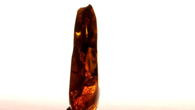 amber with inclusions on a turn table