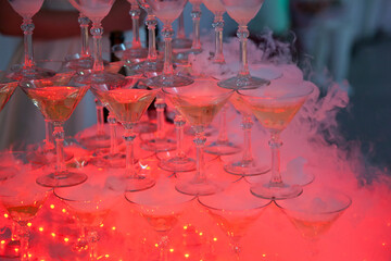 A slide of champagne with dry ice and smoke at the solemn event.