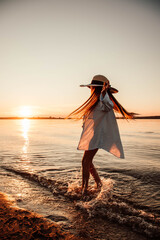 woman on the beach at sunset