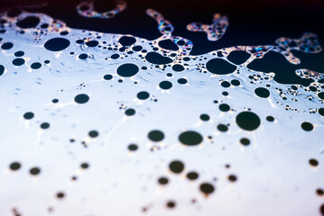 Beautiful psychedelic abstraction formed by light on the surface of a soap bubble