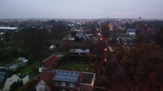 Drone shot in a small town in Belgium (Lommel) at a cloudy sunset. .