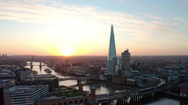 Aerial Slider drone shot of The Shard and Thames river London at sunrise
