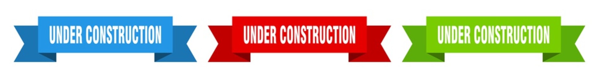 under construction ribbon. under construction isolated paper sign. banner