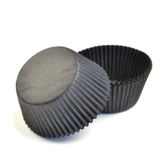 Black cupcakes paper forms isolated over white background