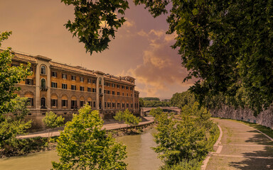 sunset in Rome Italy, fate bene fratelli hospital on Tiber river island, view from lungotevere de...