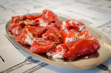 Delicious homemade stuffed peppers. Red peppers stuffed with mayonnaise and cod.
