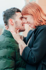 Happy Loving Couple Smiling and Hugging on the Street. Two Happy People Love Story - Medium CloseUp Portrait