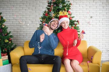 Obraz na płótnie Canvas Attractive Caucasian couple of love are celebrating Christmas in home