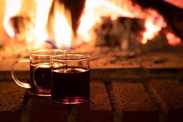 Two cups of wine by the fire, mulled wine cozy time