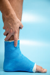 Close up photos of foot blue splint for treatment of injuries from ankle sprain.