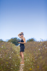 woman in field taking picture
