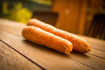 orannge carrots on wood background