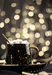 Hot chocolate cocoa on a black Christmas background with Golden bokeh