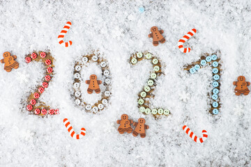 New Year 2021. Numbers in the snow. Decorative ornaments.