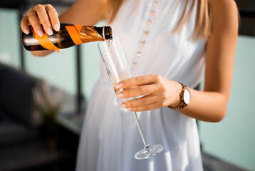 Girl pouring champagne