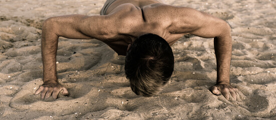 push-up exercise on sandy beach