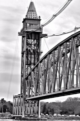 Vertical lift railroad bridge moving into the up position