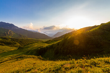 Fototapeta premium Beautiful mountain landscape at Caucasus mountains with clouds and blue sky