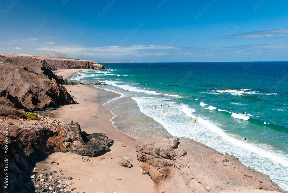 Wall mural canary island beach with surfers