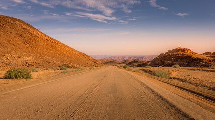 The roads of Namibia in Richtersveld Transfrontier Park near Fish River Canyon during sunset. © Gunter