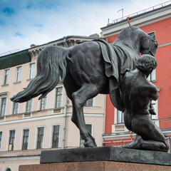 Fototapeta na wymiar Equestrian sculptures on the Anichkov bridge over the Neva river in St. Petersburg, Russia