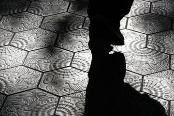 walking on decorative tiles