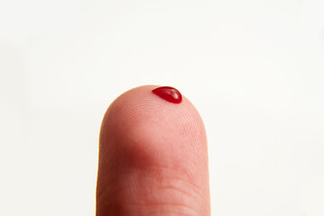 Blood drop on finger, medical test of health