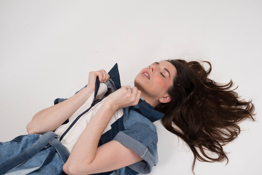 female model posing on white background