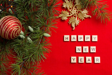 little girl lies on white blanket and holds gift
