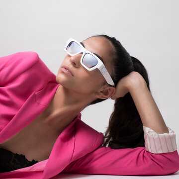female model posing on white background