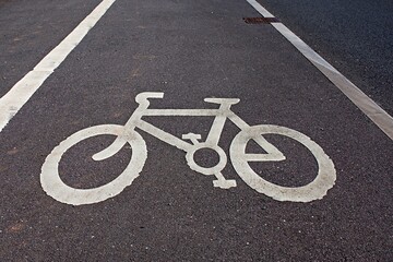Fototapeta premium Sign white cycle/bicycle painted on the ground. Cycle path. UK