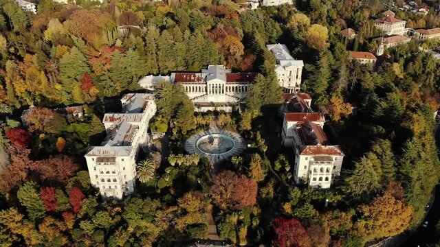 Aerial view of an old abandoned castle in the forest with a large dry fountain. Sochi. Russia.