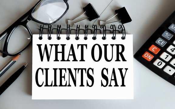 What Our Clients Say. Text On White Paper On A Gray Background.