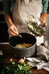 Woman in the kitchen preparing homemade food