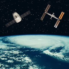 Satellites above the earth. The elements of this image furnished by NASA.