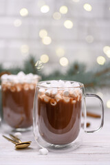 glass cup of cocoa on the buckground of gold bokeh, New Year hot drink