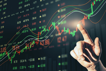 Hand pushing glowing stock chart