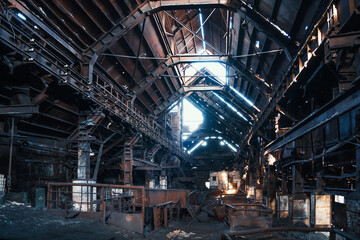 Hangar of old rusty abandoned industrial metallurgical factory.