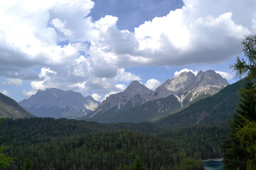 Fototapeta premium Alps against a blue sky and beautiful clouds.