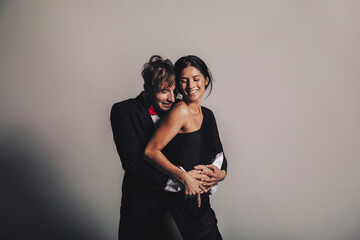 Fun couple smiling. Couple in love. Love concept. Elegant dress. Sensual. Happy day. 