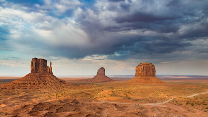 Fototapeta na wymiar Landscape of the monument valley, USA, with dark dramatic clouds on the background