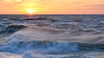 Obraz premium Stormy sea at sunset, Baltic, pink, orange, soft pastel colors