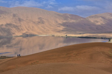 Fototapeta na wymiar Sumu Barun Jaran Lake-mirroring dark water. Badain Jaran Desert-Inner Mongolia-China-1153