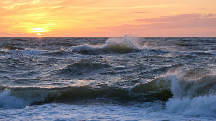 Stormy sea at sunset, Baltic, pink, orange, soft pastel colors


