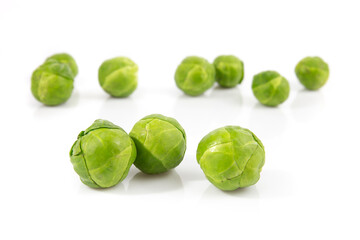 Brussels sprout isolated on white background. Still-life picture of green cabbages taken in studio with soft-box.