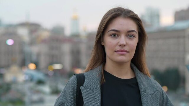 Young woman looks at you