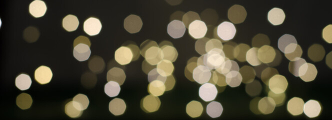 Panoramic photo of bokeh of white-yellow lights